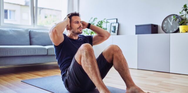 a man doing situps at home